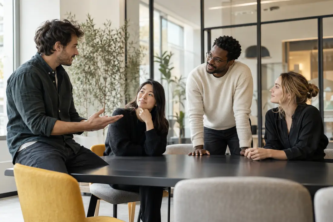 The MsgDrip team talking around a table